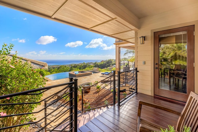 balcony featuring a water view