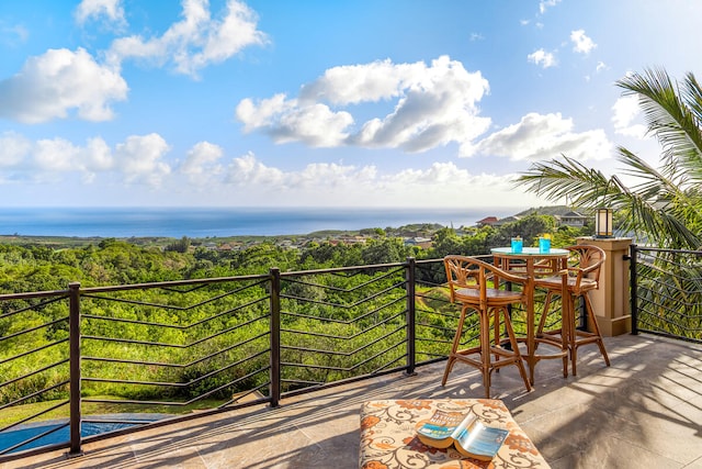 balcony featuring a water view