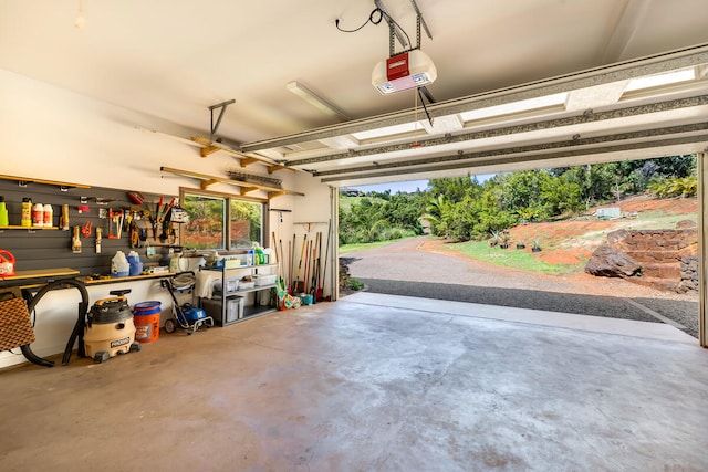 garage featuring a workshop area and a garage door opener