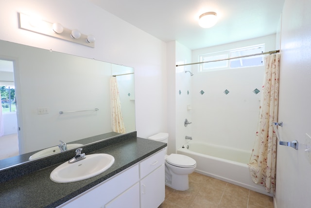 full bathroom with tile patterned floors, plenty of natural light, shower / bath combination with curtain, and toilet