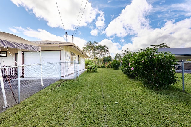 view of yard featuring a garage