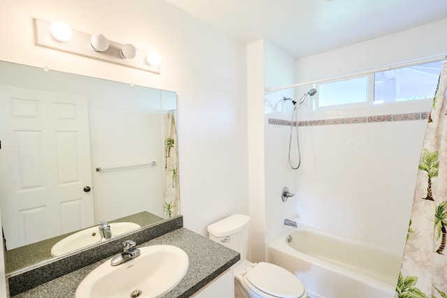 full bathroom with vanity, shower / bath combo, and toilet