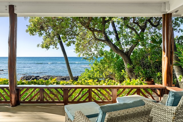 wooden deck with a water view