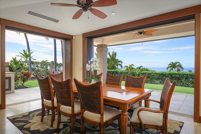 tiled dining room featuring ceiling fan