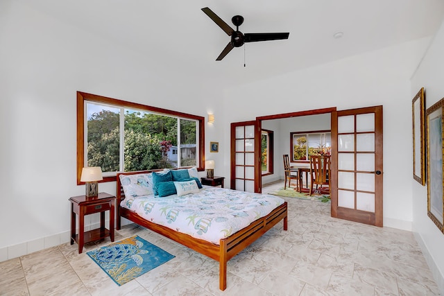 bedroom featuring french doors and ceiling fan