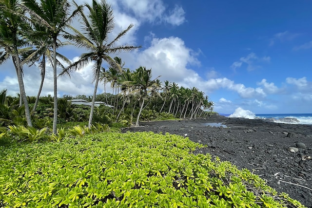 exterior space with a beach view and a water view