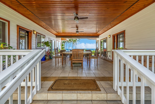 exterior space with ceiling fan