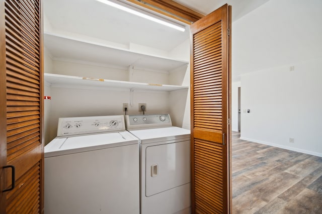 laundry area featuring light wood-type flooring and washing machine and clothes dryer