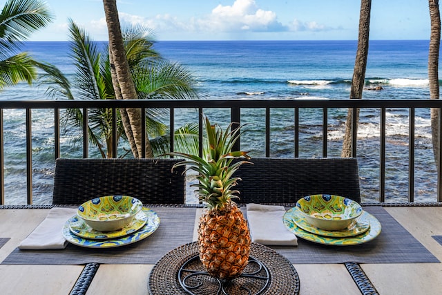 balcony featuring a water view