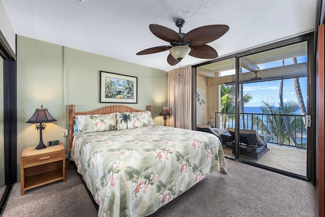 bedroom featuring access to outside, ceiling fan, and carpet