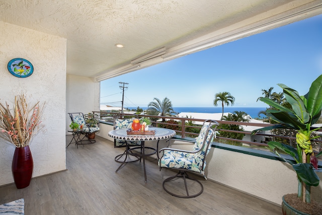 balcony featuring a water view