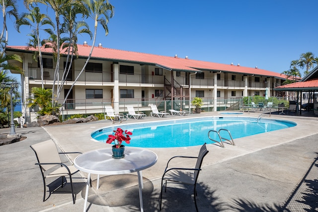 view of swimming pool featuring a patio area