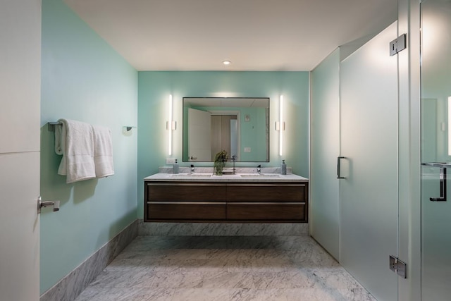 bathroom featuring vanity and an enclosed shower