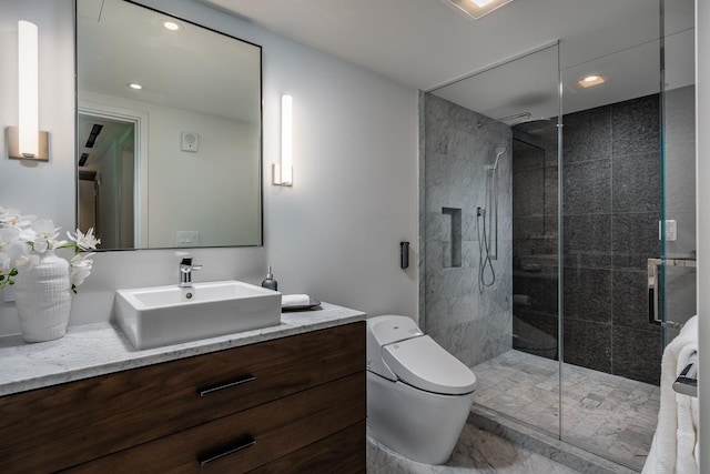 bathroom featuring vanity, toilet, and a shower with door