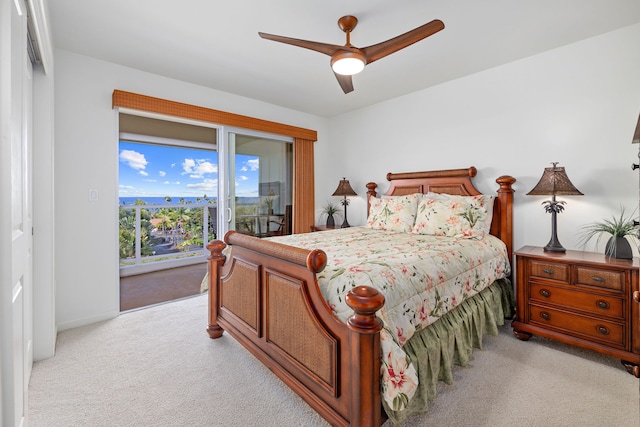 carpeted bedroom with ceiling fan and access to exterior