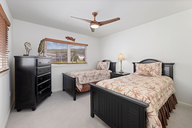 bedroom featuring ceiling fan and light colored carpet