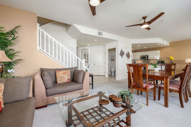 living room featuring ceiling fan