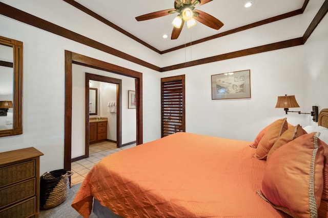 bedroom featuring light tile patterned floors, ensuite bath, ceiling fan, and ornamental molding