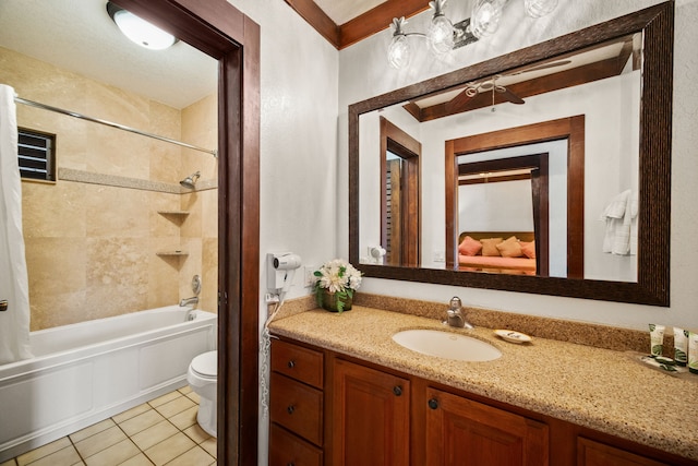 full bathroom featuring tile patterned floors, vanity, toilet, and tiled shower / bath