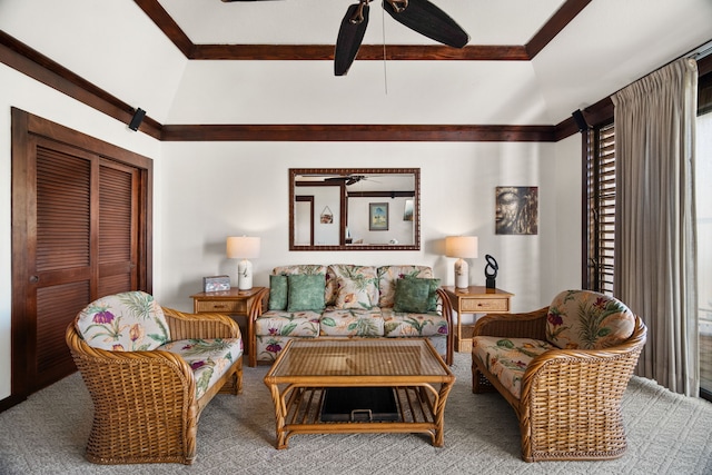 living room with carpet flooring, ceiling fan, and vaulted ceiling with beams