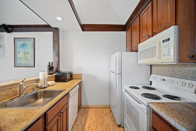 kitchen featuring white appliances, sink, decorative backsplash, light stone countertops, and light hardwood / wood-style floors