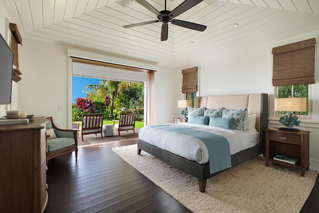 bedroom with dark hardwood / wood-style floors, ceiling fan, and wooden ceiling