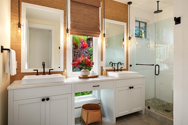 bathroom with tile patterned flooring, vanity, and a shower with shower door