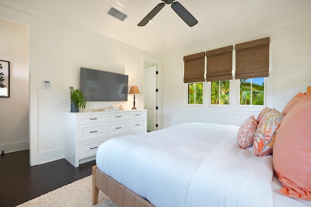 bedroom featuring ceiling fan and dark wood-type flooring