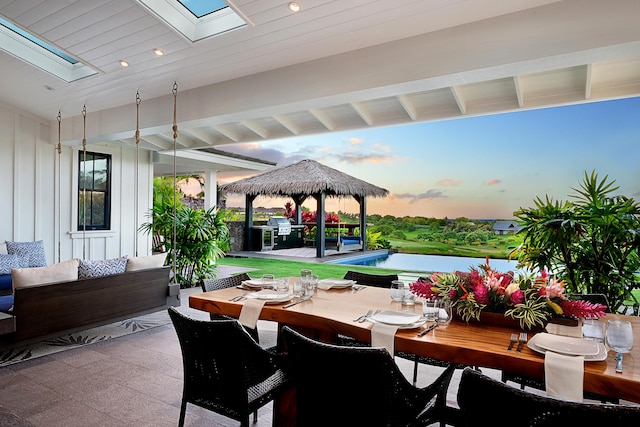 patio terrace at dusk with a gazebo and an outdoor living space