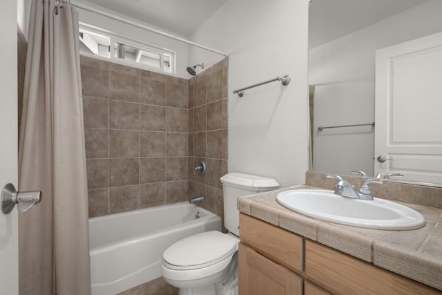 full bathroom with vanity, toilet, and shower / bath combo with shower curtain