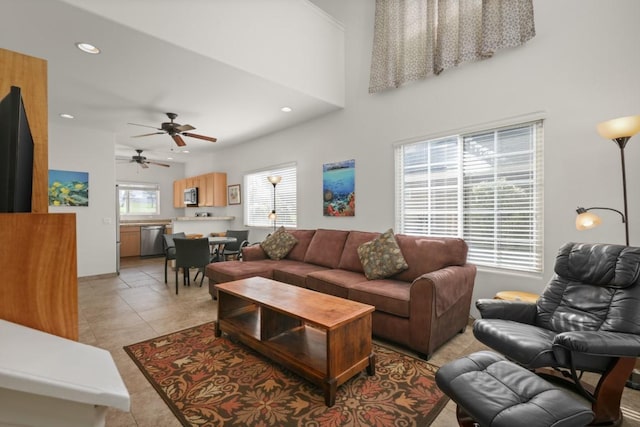 tiled living room with ceiling fan