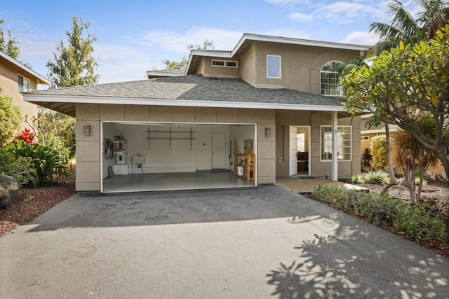 view of front facade featuring sink and a garage