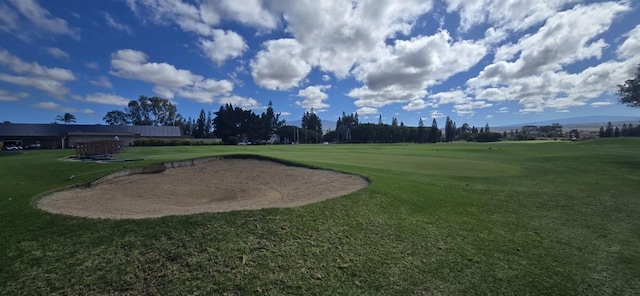surrounding community featuring a lawn