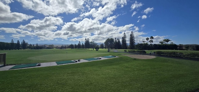 view of home's community featuring a lawn