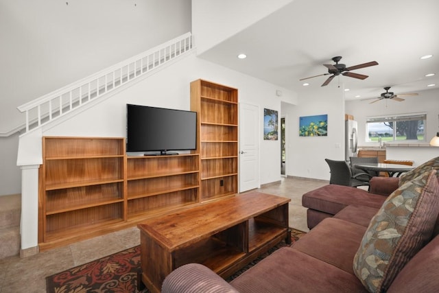 living room featuring ceiling fan and sink