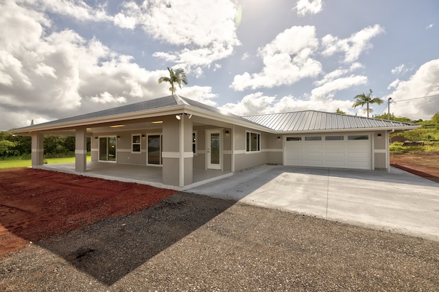 view of front of house with covered porch and a garage