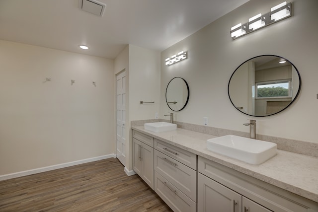 bathroom featuring vanity and hardwood / wood-style flooring