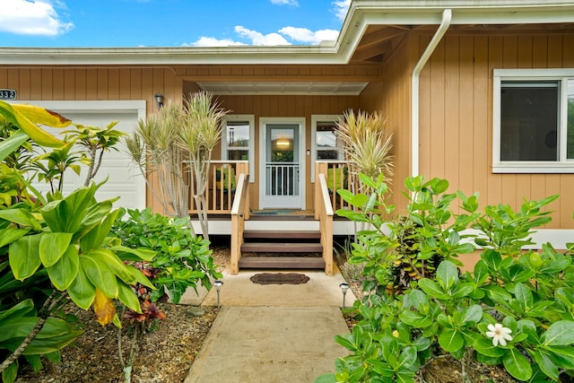 doorway to property featuring a garage