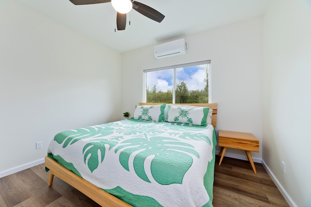 bedroom with an AC wall unit, ceiling fan, and dark wood-type flooring