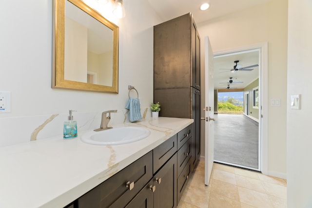 bathroom featuring tile patterned flooring, vanity, and ceiling fan