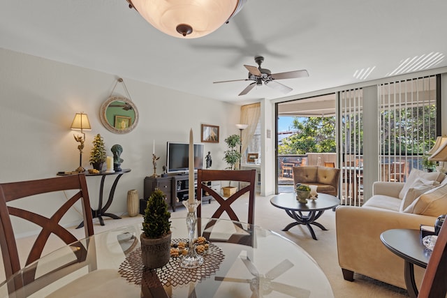 carpeted living room featuring ceiling fan