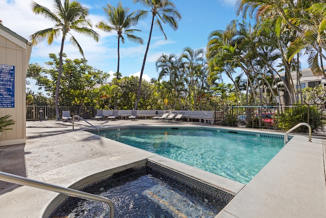 view of swimming pool with a community hot tub and a patio