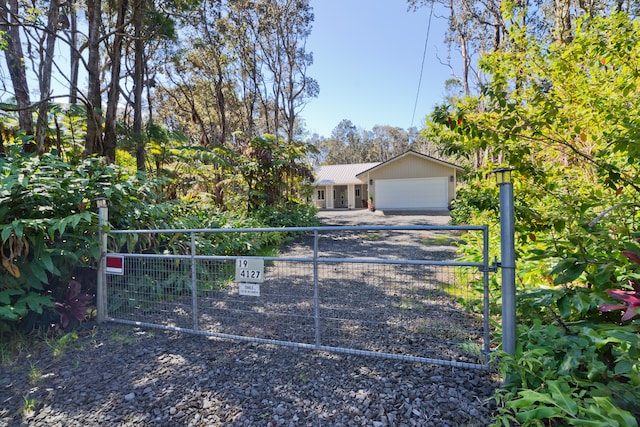 ranch-style house featuring a garage