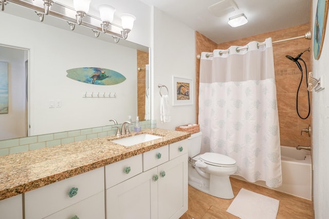 3880 Wyllie Rd Unit 11A, Princeville, HI 96722 - bathroom featuring toilet, shower / bath combo, vanity, decorative backsplash, and tile patterned flooring