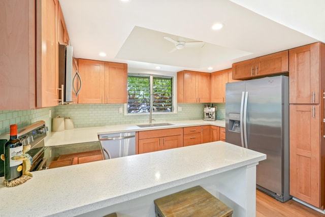 3880 Wyllie Rd Unit 11A, Princeville, HI 96722 - kitchen with stainless steel appliances, a sink, recessed lighting, a peninsula, and tasteful backsplash