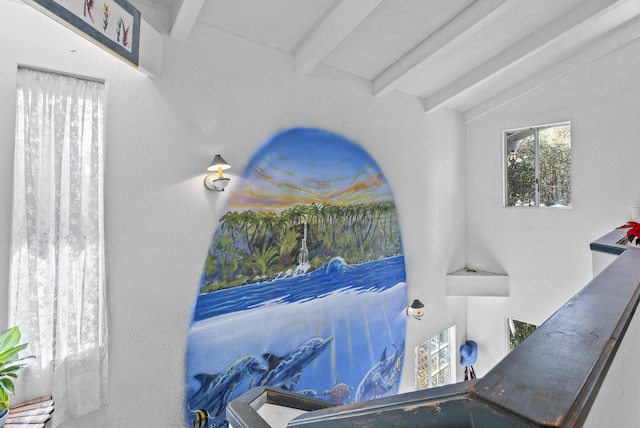 interior space featuring vaulted ceiling with beams