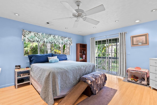 bedroom with light wood-type flooring, access to outside, and ceiling fan