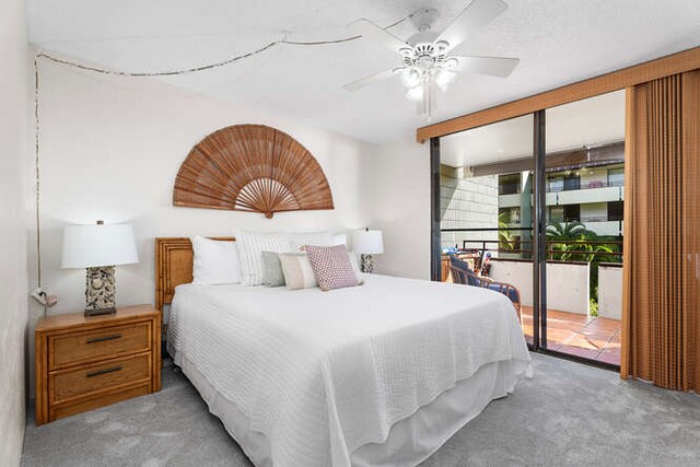 carpeted bedroom featuring ceiling fan and access to exterior