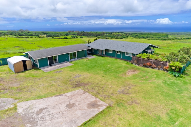 birds eye view of property with a rural view