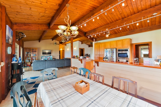 dining space with wood ceiling, light tile patterned floors, lofted ceiling with beams, and ceiling fan with notable chandelier